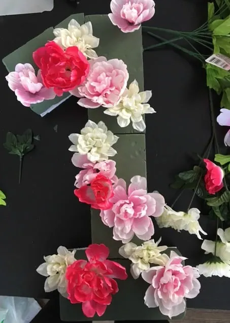 Easy DIY floral monogram awesome for weddings or birthday parties. Can't believe how easy this is to make