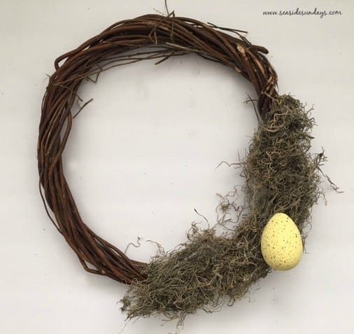 DIY Easter wreath using items from the dollar store. Dollartree easy Easter egg wreath