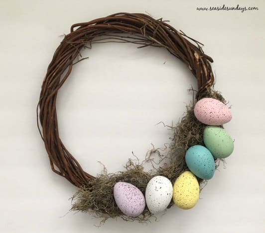 DIY Easter egg wreath using items from the dollar store. Dollartree easy Easter egg wreath
