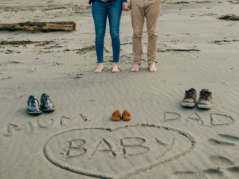 Pregnancy announcement on the beach