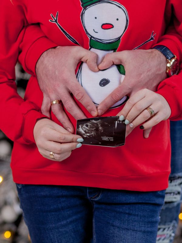 hands turned into hearts pregnancy announcement