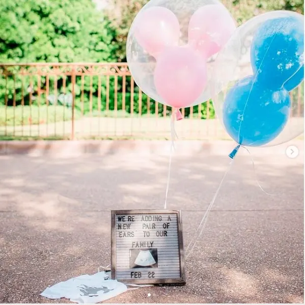 Pregnancy announcement with Disney balloons