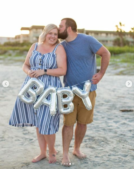 Baby balloon pregnancy announcement on the beach