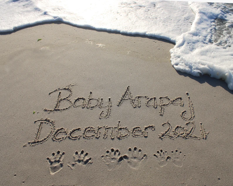 pregnancy announcement beach writing 