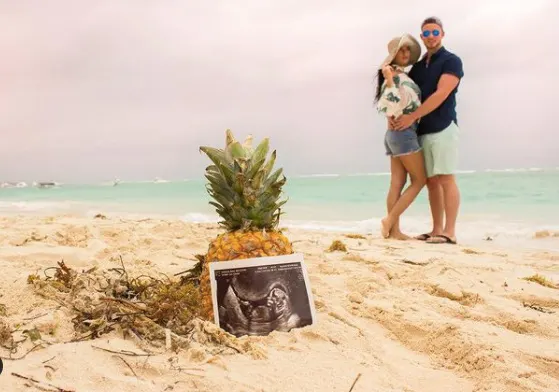 Ultrasound on beach pregnancy announcement 