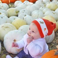 visit a pumpkin patch to make Baby's first halloween special